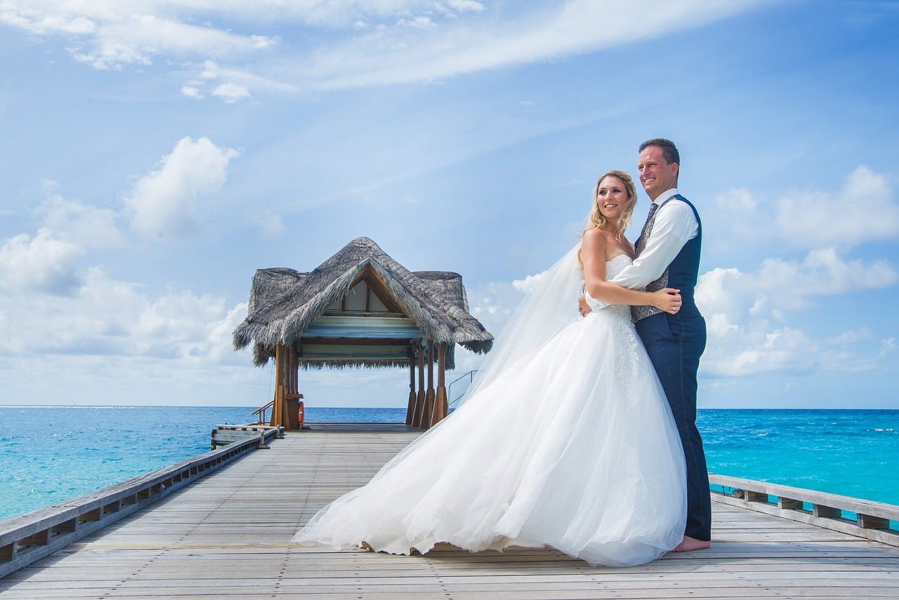 Bride and Groom taking pictures on a pier on Saba Island in the Caribbean